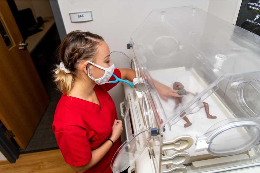 The Nursing Learning Laboratory has a baby high-fidelity human simulator so students can learn how to care for infants.